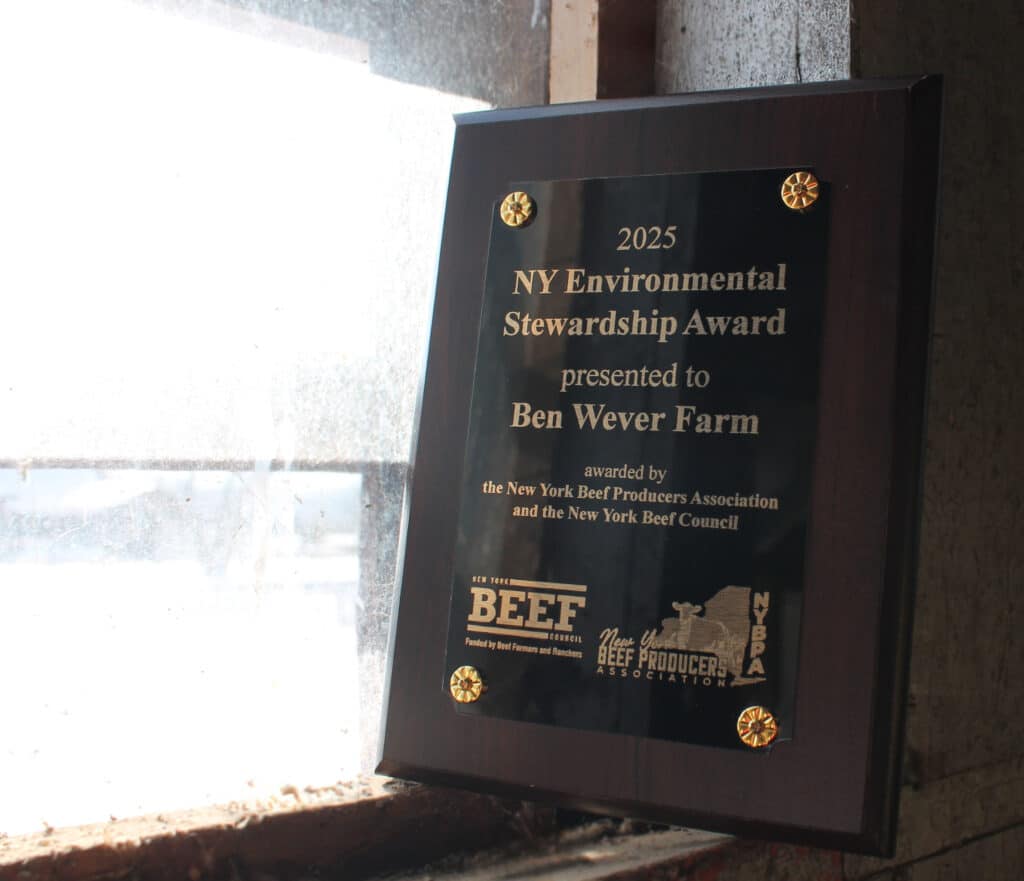 A photo of the Environmental Stewardship Award presented to Ben Wever Farm in 2025 by NY Beef Council and the NY Beef Producers Association.