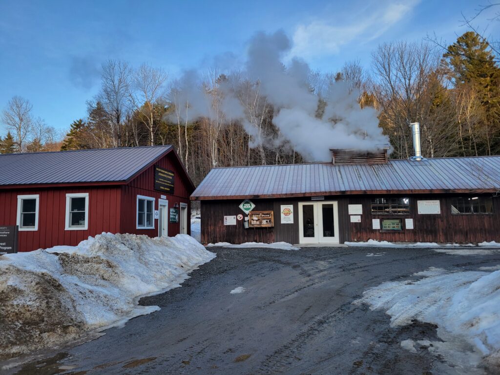 Uihlein Sugarhouse with steam rising from their maple flume.