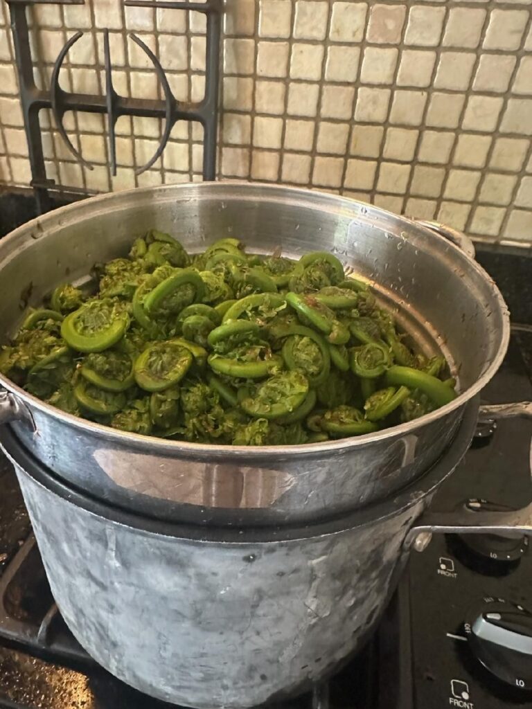 Boiling green vegetables in a large pot
