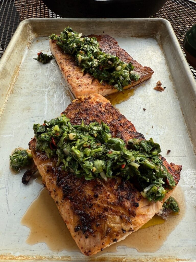 Grilled salmon with greens on a tray
