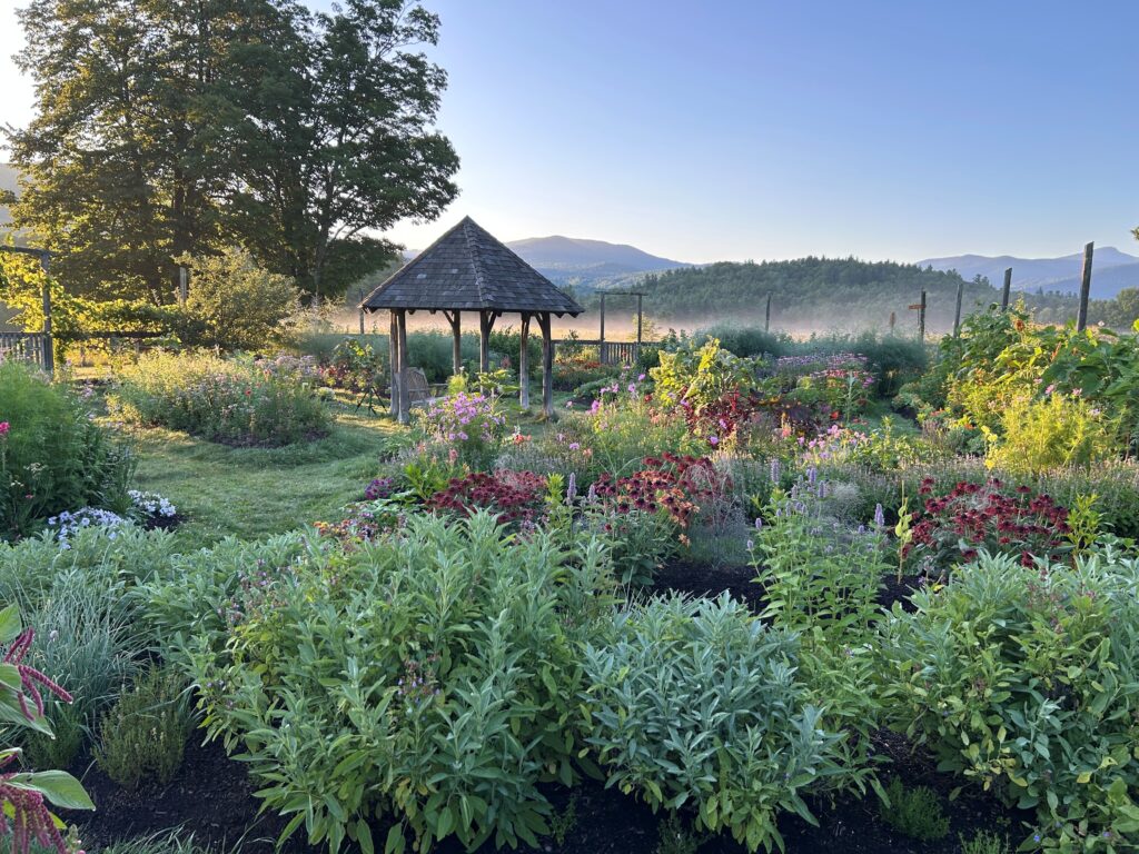 Scenic garden with gazebo and mountains