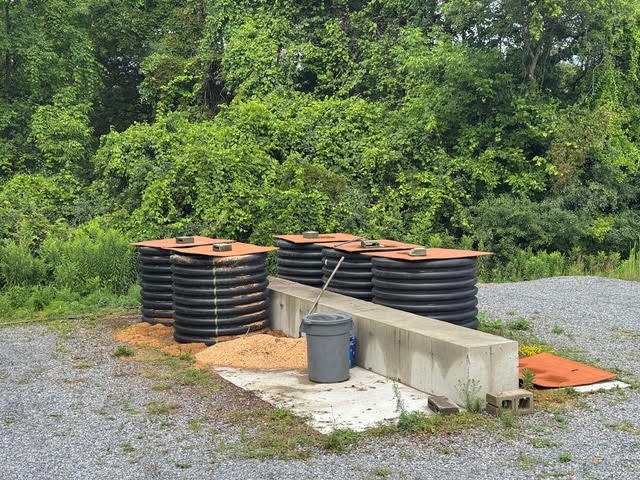 Rustic septic tanks in forest setting