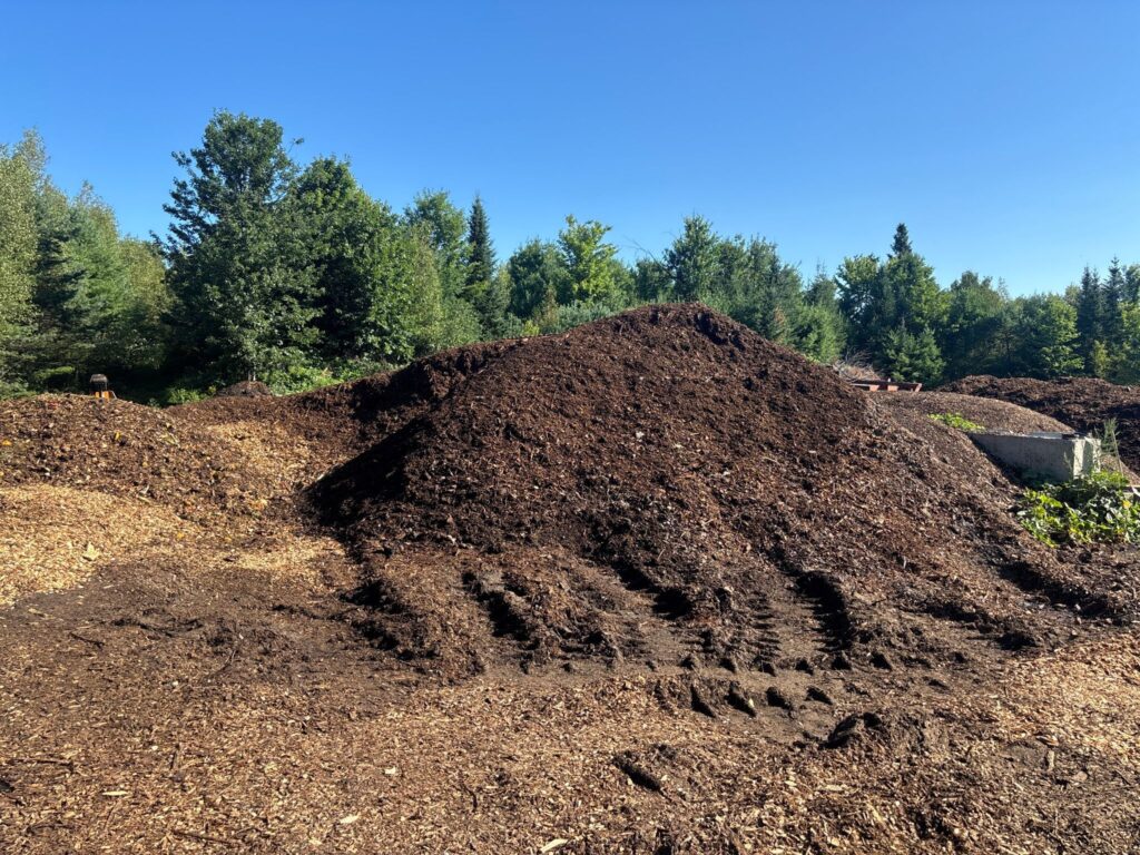 Pile of compost and wood chips outdoors