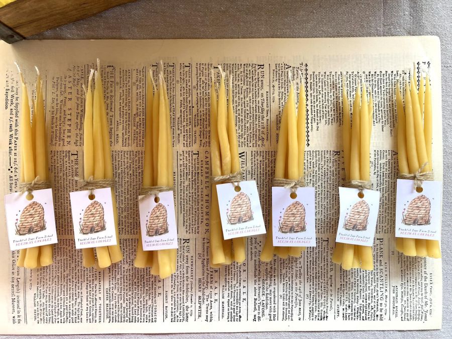 Beeswax candles on vintage book page